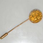 A `Sun Disk" with natural gold nuggets as a stick/tie pin.
