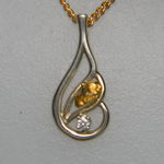 Nugget and diamond `Swirl` white gold pendant.