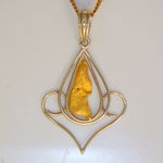 Nugget pendant with fancy solid gold frame